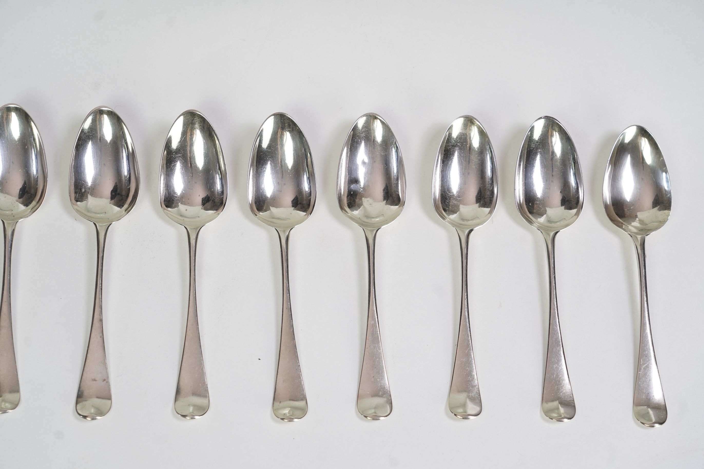 A set of twelve George III silver Hanoverian pattern table spoons by Walter Tweedie, the terminals engraved with the family crest of The Right Reverend Robert Lowth, Bishop of London, (1710-1787)